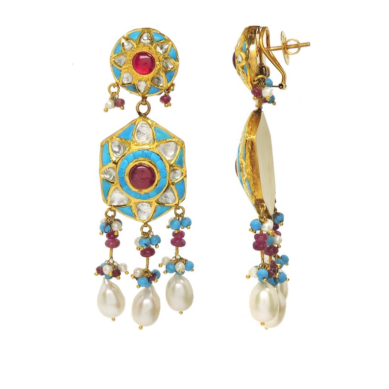 May include: Gold earrings with turquoise and red stones, and pearl drops. The earrings have a geometric design and are decorated with intricate details.