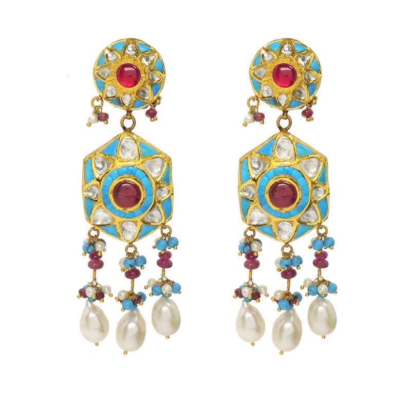 May include: A pair of gold earrings with turquoise and white enamel, red gemstones, and pearl drops.
