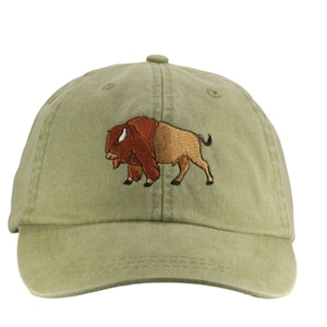 May include: A green baseball cap with an embroidered brown and tan bison on the front.