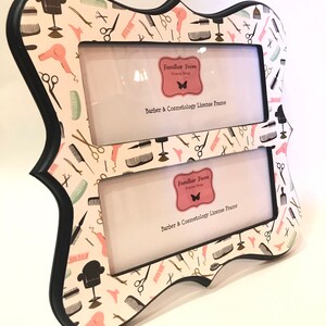 May include: A double photo frame with a black border and a pattern of barber and cosmetology tools on a cream background. The frame includes the text "Barber & Cosmetology License Frame".