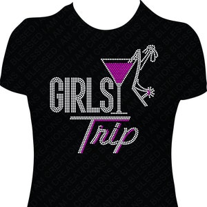 May include: Black t-shirt with a rhinestone design that says "Girls Trip" with a pink cocktail glass and a high heel shoe.