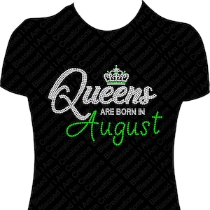 May include: Black t-shirt with a white rhinestone design that says "Queens are born in August" with a green rhinestone crown above the word "Queens".
