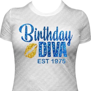 May include: White t-shirt with a blue glitter "Birthday Diva" graphic, gold glitter lips, and "EST 1975" text. The design is centered on the front of the shirt, suitable for a birthday celebration.