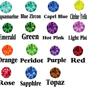 May include: Chart of 12 different coloured gemstones, including aquamarine, blue zircon, capri blue, citrine, emerald, green, hot pink, light pink, orange, peridot, purple, red, rose, sapphire, and topaz.