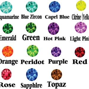 May include: Chart of 12 different colored gemstones, including aquamarine, blue zircon, capri blue, citrine, emerald, green, hot pink, light pink, orange, peridot, purple, red, rose, sapphire, and topaz.