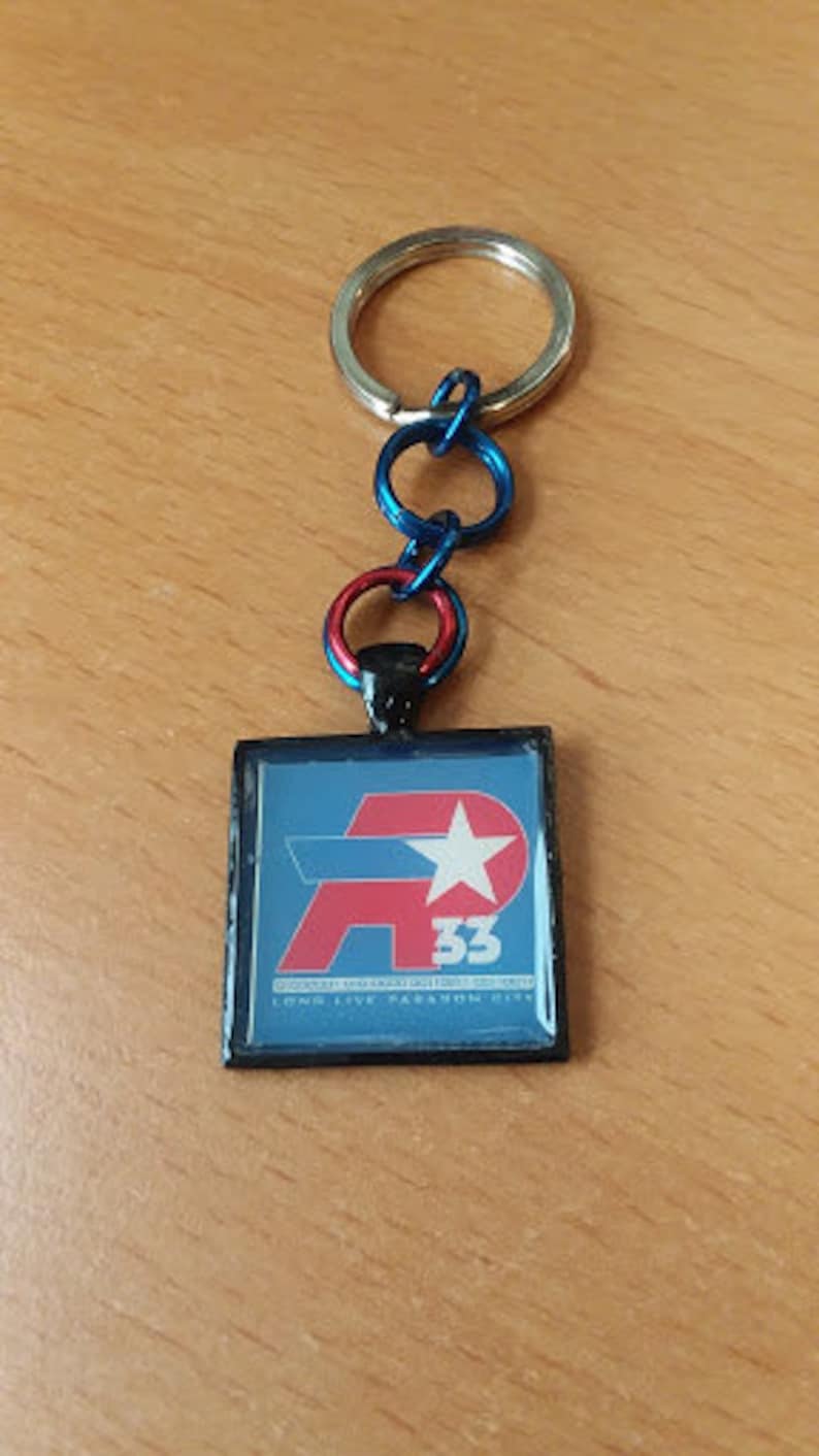 Item Number 7038 City of Heroes Remembrance AP33 Key Chain