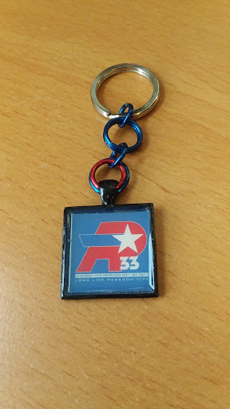 Item Number 7038 City of Heroes Remembrance AP33 Key Chain