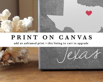 May include: A grey canvas print featuring a white silhouette of the state of Texas with a small red heart icon. The text PRINT ON CANVAS and add an unframed print + this listing to cart to upgrade is overlaid in black and white text.