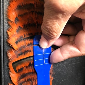 Goose  feather lei hatband supply only. 2 ounce feathers and felt base no tools, stands or tutorial. Adding to your original supplies