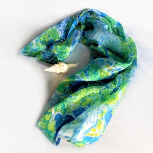 Large, Long, Rectangular Silk Scarf, With Busy, Abstract  Batik style, And White Convolvulus flowers. In blue, green, turquoise, and yellow.