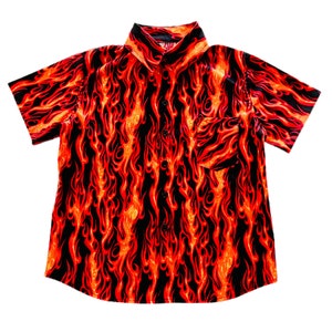 May include: A short-sleeved button-down shirt with a black background and a red and orange flame pattern.