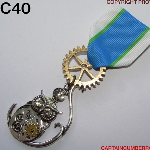 Steampunk pin badge brooch medal with silver clockwork owl on blue green & white ribbon #MCC40