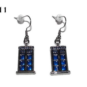 May include: A pair of silver earrings with blue enamel TARDIS designs. The earrings have a hook fastening.
