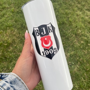 May include: White stainless steel tumbler with a black and white logo featuring the text "BJK 1903" and a red crescent moon and star.