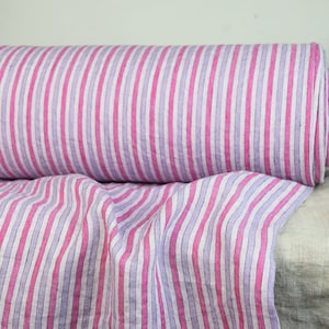 IN STOCK. Linen fabric fabric Aurora Striped Pink 160gsm. Striped in pale pink, lavender and hot pink. Quite light weight, washed-softened.