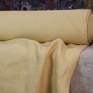 Pure 100% linen fabric Gloria Laguna Yellow 200gsm (6oz/yd2). Muted, mellow peachy yellow. Washed-softened.