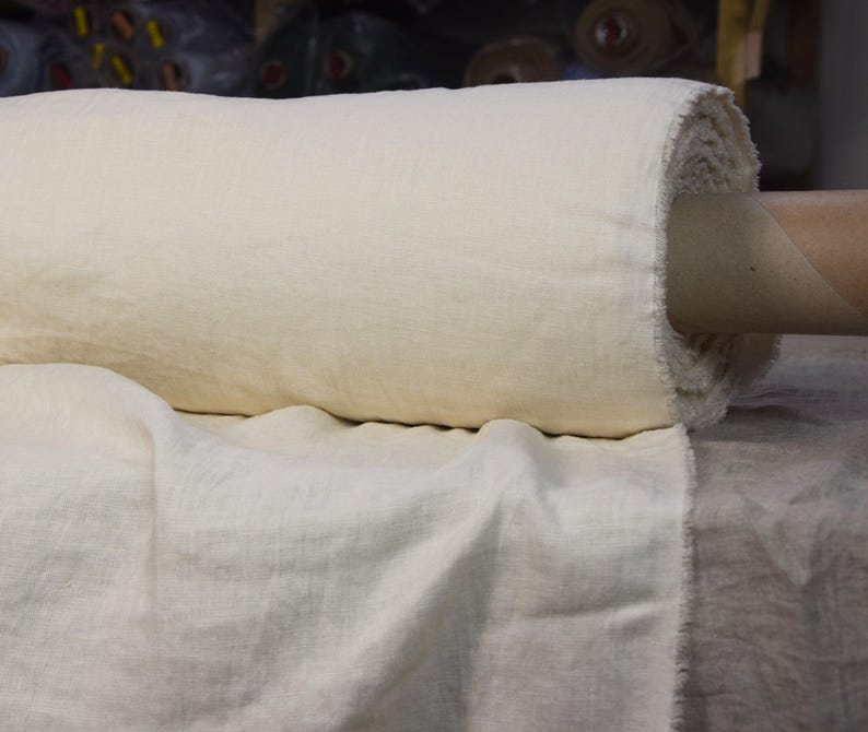 Pure linen fabric. It has a very slight tint of creamy/yellowish/grayish and even a pinkish at the same time, very pale, milky, smooth and buttery. The fabric is middle weight, strong and durable, densely and plain woven, not sheer.