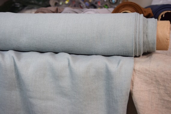 Temporarily OUT OF STOCK. Pure 100% linen fabric Nata Bleu Clair 250gsm. Pastel blue, slightly greenish hue. Washed-softened.