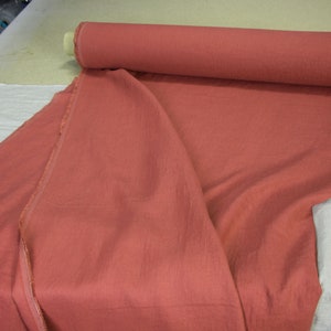 Pure linen fabric Gloria Red River Clay from LINENGRAPHY. This glamorous, deep, rare and original shade of red holds together brownish and purplish tones. Rich but not too bright. Middle weight, dense, not sheer, plain.