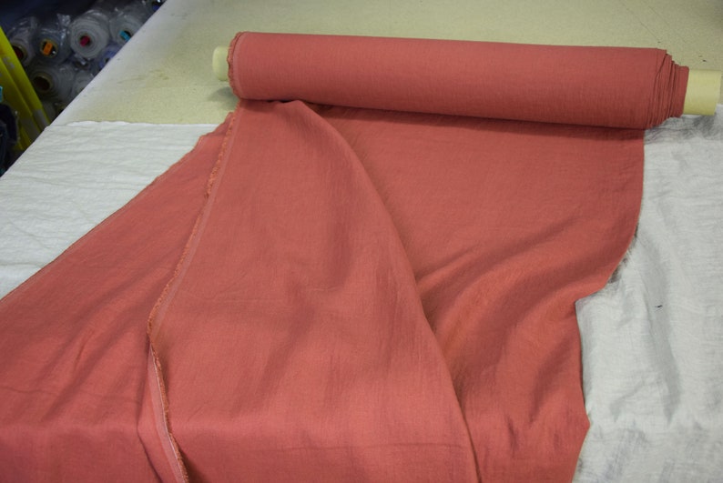 Pure linen fabric Gloria Red River Clay from LINENGRAPHY. This glamorous, deep, rare and original shade of red holds together brownish and purplish tones. Rich but not too bright. Middle weight, dense, not sheer, plain.