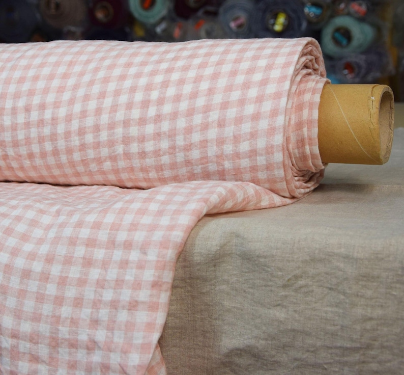 Pure linen fabric Aurora Blush Pink Gingham. The fabric is dense, not sheer, naturally wrinkled. Clolors of the gingham are white and pale pink. Cells are 8mm. The fabric is aesthetic, strong, durable, organic, pleasant to touch, pre-shrunk.