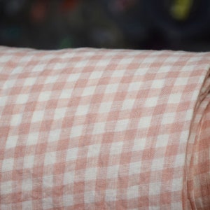 Pure linen fabric Aurora Blush Pink Gingham. The fabric is dense, not sheer, naturally wrinkled. Clolors of the gingham are white and pale pink. Cells are 8mm. The fabric is aesthetic, strong, durable, organic, pleasant to touch, pre-shrunk.