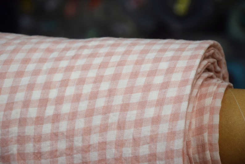 Pure linen fabric Aurora Blush Pink Gingham. The fabric is dense, not sheer, naturally wrinkled. Clolors of the gingham are white and pale pink. Cells are 8mm. The fabric is aesthetic, strong, durable, organic, pleasant to touch, pre-shrunk.