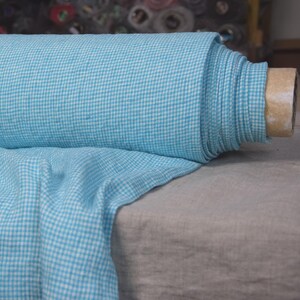 Pure linen fabric Terra Turquoise Gingham. Small mini 2mm vichy (gingham) checks. Quite bright, saturated  turquoise blue. Middle weight. Densely woven, not sheer.