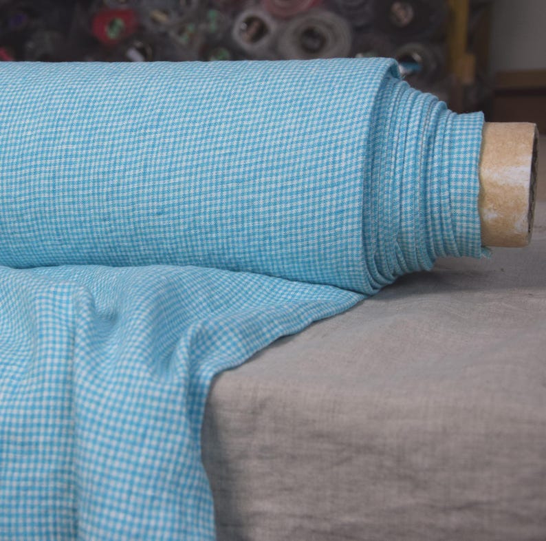 Pure linen fabric Terra Turquoise Gingham. Small mini 2mm vichy (gingham) checks. Quite bright, saturated  turquoise blue. Middle weight. Densely woven, not sheer.