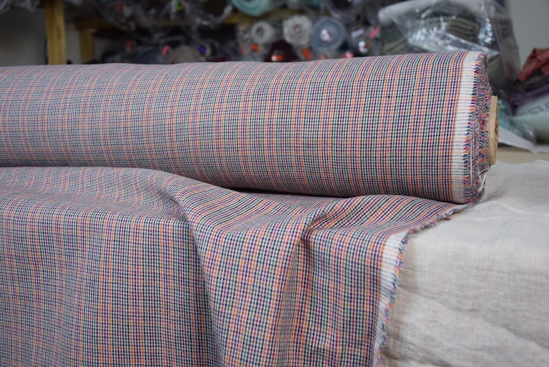 Linen/cotton fabric Mabela Multicolor Tweed. Quite heavy weight striped twill. Very small woven houndstooth pattern, color mix: beige, green, orange, burgundy, navy. Aesthetic, strong and durable, organic, antistatic, breathing, pleasant to touch.