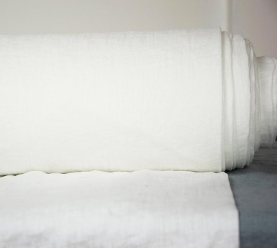 Linen fabric "Aura Stark White" 125gsm (3.7oz/yd2). 100% Pure. Thin, washed, dense, soft. Optical white. Widht 145cm (57"). IN STOCK.
