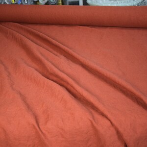 Pure linen fabric Udana Rust blends into any modern interior. 
The Rust color is saturated burnt brown-orange. Quite bright and highlighted, resembling iron oxide.