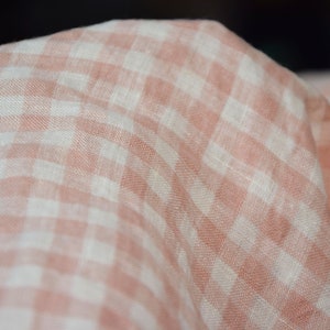 Pure linen fabric Aurora Blush Pink Gingham. The fabric is dense, not sheer, naturally wrinkled. Clolors of the gingham are white and pale pink. Cells are 8mm. The fabric is aesthetic, strong, durable, organic, pleasant to touch, pre-shrunk.