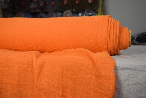 Temporarily OUT OF STOCK. Linen fabric Pura Electric Orange. Thin semi-sheer gauze. 100% linen 110gsm. Loosely woven. Washed-softened.