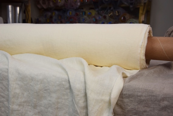 WHOLESALE. Pure 100% linen fabric Gloria Vanilla 200gsm (5.90oz/yd2). Middle weight, densely woven. Yellowish cream ivory off-white tint.