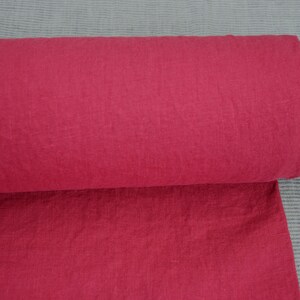 May include: A roll of bright red fabric with a textured surface.