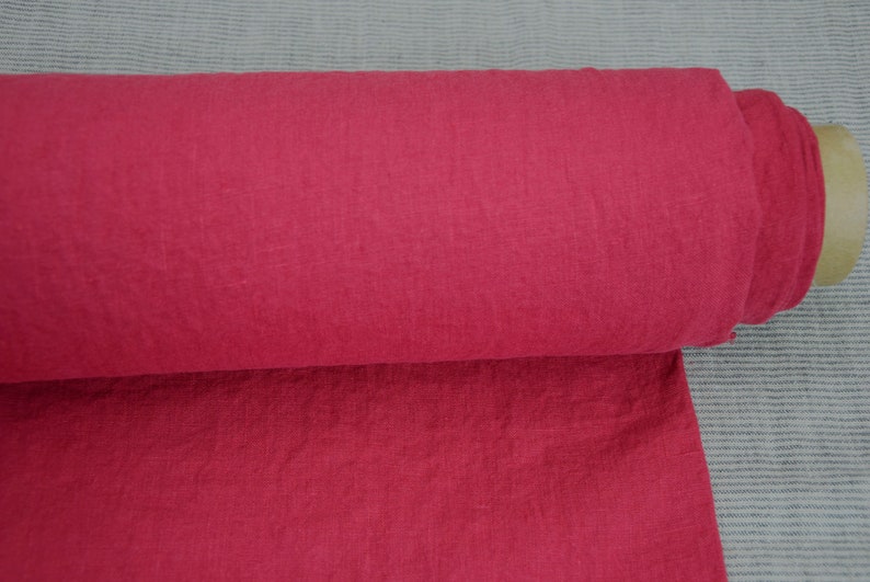 May include: A roll of bright red fabric with a textured surface.
