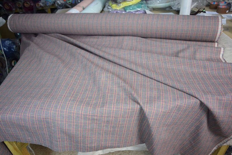 Linen/cotton fabric Mabela Multicolor Tweed. Quite heavy weight striped twill. Very small woven houndstooth pattern, color mix: beige, green, orange, burgundy, navy. Aesthetic, strong and durable, organic, antistatic, breathing, pleasant to touch.