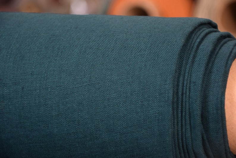 Pure linen fabric Gloria Slate Teal.  Blue and green, saturated dark teal is dressy and dramatic. A dose of black gives it a deep richness. Middle weight, dense, not sheer, plain. Washed-softened, will not  shrink any more.