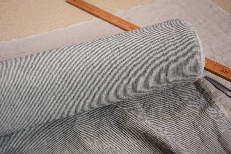 Pure linen fabric Elba Iguana Pencil Stripes, middle weight dense, not sheer, soft. Natural not dyed flax and dark green-gray narrow stripes (like a drawn with a pencil) . Width of the stripe is 1.5mm (one natural + one gray is 3mm).