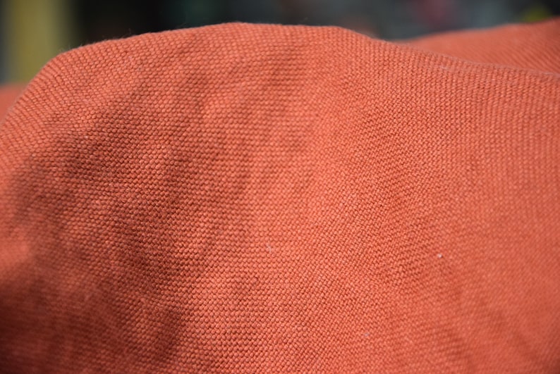Pure linen fabric Udana Rust blends into any modern interior. 
The Rust color is saturated burnt brown-orange. Quite bright and highlighted, resembling iron oxide.