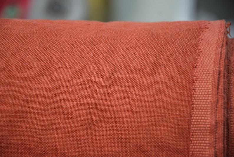 Pure linen fabric Udana Rust blends into any modern interior. 
The Rust color is saturated burnt brown-orange. Quite bright and highlighted, resembling iron oxide.