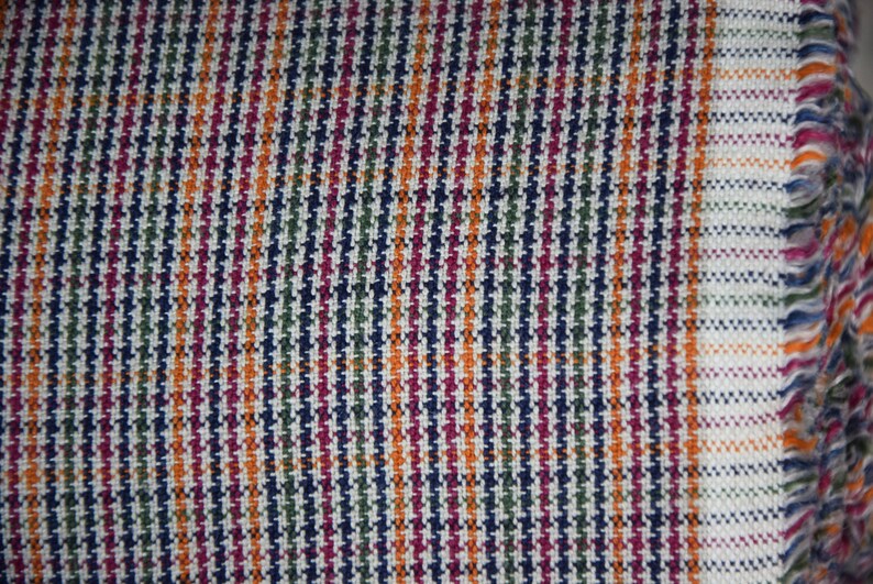 Linen/cotton fabric Mabela Multicolor Tweed. Quite heavy weight striped twill. Very small woven houndstooth pattern, color mix: beige, green, orange, burgundy, navy. Aesthetic, strong and durable, organic, antistatic, breathing, pleasant to touch.