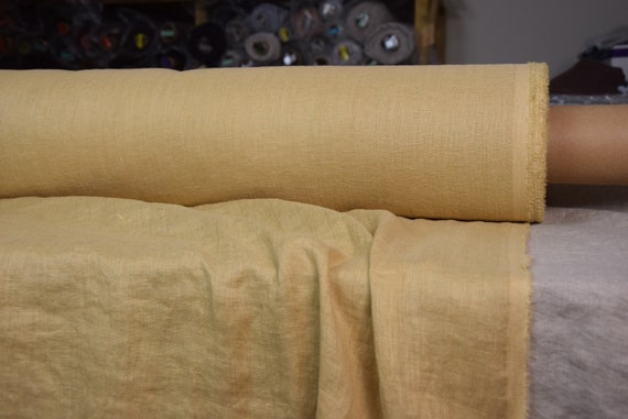 Very thin 95gsm semi-sheer pure 100% linen fabric Serena Laguna Yellow 95gsm. Muted, not bright mellow yellow. Washed-softened.