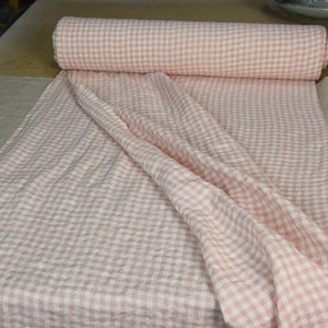 Pure linen fabric Aurora Blush Pink Gingham. The fabric is dense, not sheer, naturally wrinkled. Clolors of the gingham are white and pale pink. Cells are 8mm. The fabric is aesthetic, strong, durable, organic, pleasant to touch, pre-shrunk.