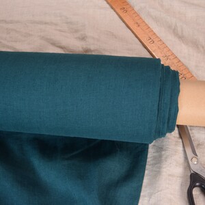 Pure linen fabric Gloria Slate Teal.  Blue and green, saturated dark teal is dressy and dramatic. A dose of black gives it a deep richness. Middle weight, dense, not sheer, plain. Washed-softened, will not  shrink any more.