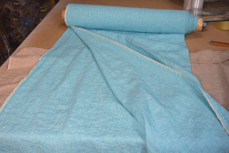 Pure linen fabric Terra Turquoise Gingham. Small mini 2mm vichy (gingham) checks. Quite bright, saturated  turquoise blue. Middle weight. Densely woven, not sheer.