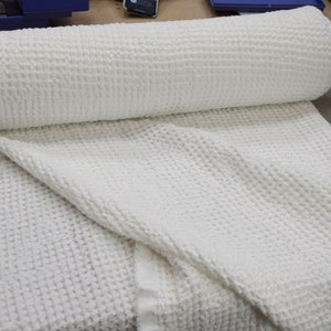 This fabric is aesthetic, strong and durable. 
Natural, organic, eco-friendly and antistatic. 
Relaxing, tranquil, breathing, pleasant to touch. Densely woven, fluffy, waffle pattern. 
Softened, washed, pre-shrunk. 
Machine washable or dry cleanable.