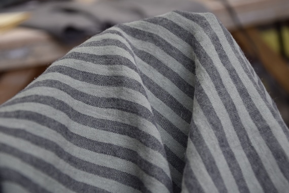 Temporarily OUT OF STOCK. 100% linen fabric Regina Bengal Stripes Khaki Green 130gsm. Green/black 8mm stripes. Light weight, pre-shrunk.