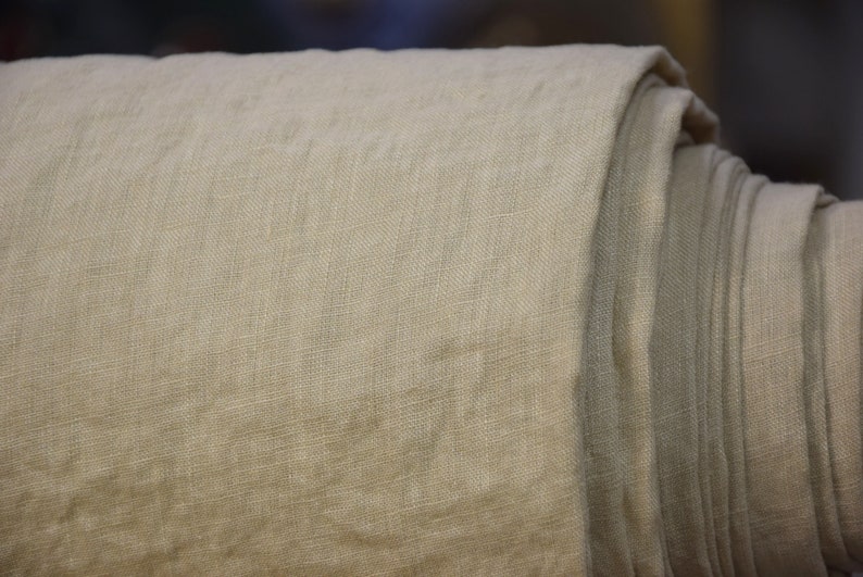 Pure linen fabric Regina Sesame. Light weight, not sheer. Pantone 15-1215 Tcx Sesame Color (beige color with some pale brownish-sand and greenish undertones). Drape characteristic are very good. Plain, densely woven. Pre-washed, naturally wrinkled.